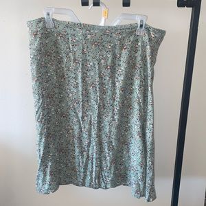 Knee length skirt. Small slit on the side